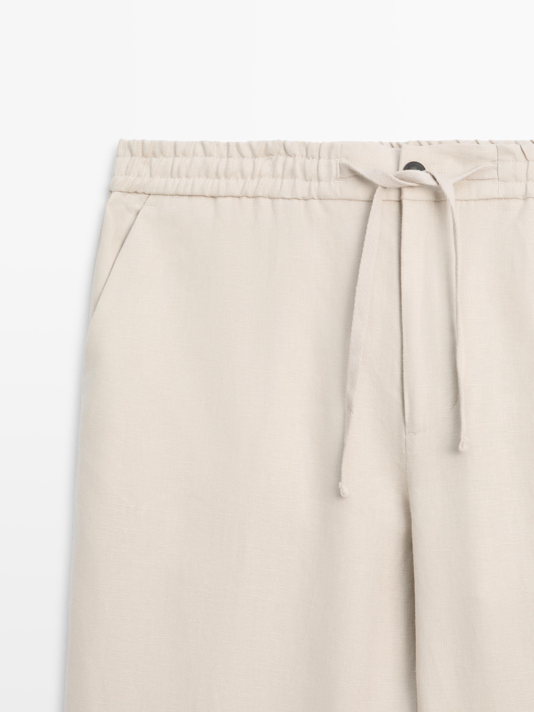 Total look linen trousers with waist detail